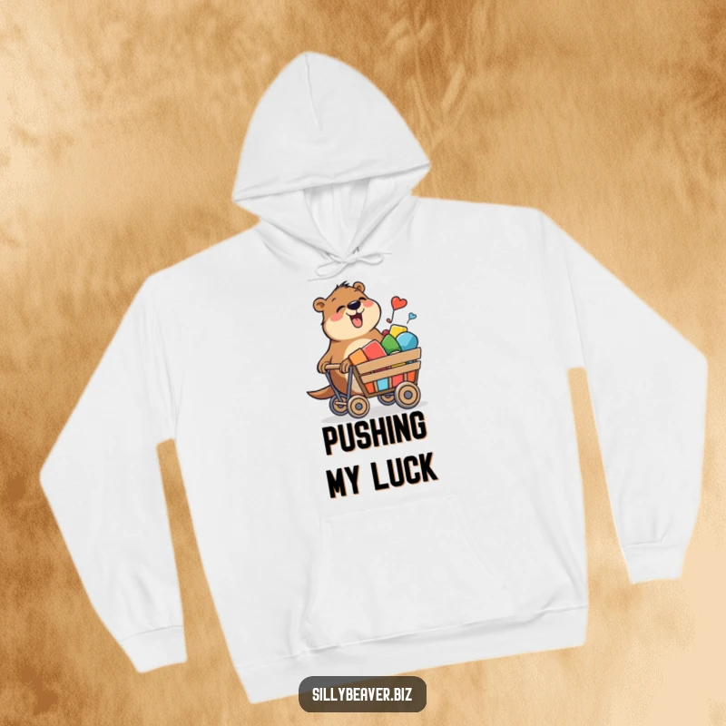 Funny hoodie showcasing a beaver joyfully pushing a rolling cart filled with colorful shapes, blending comfort and creativity.