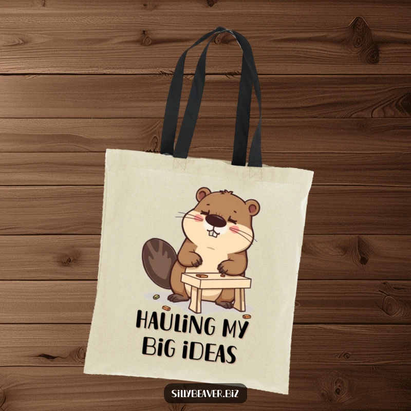 Funny tote bag featuring a determined beaver with a miniature desk-building project, perfect for a humorous, practical accessory.